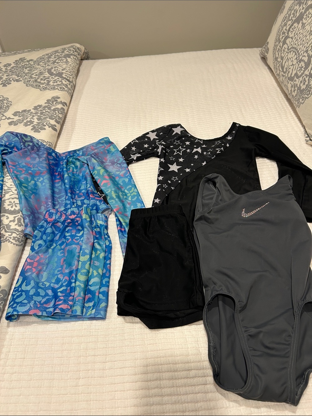 Bundle of 4 girls gymnastics leotards. Size small.